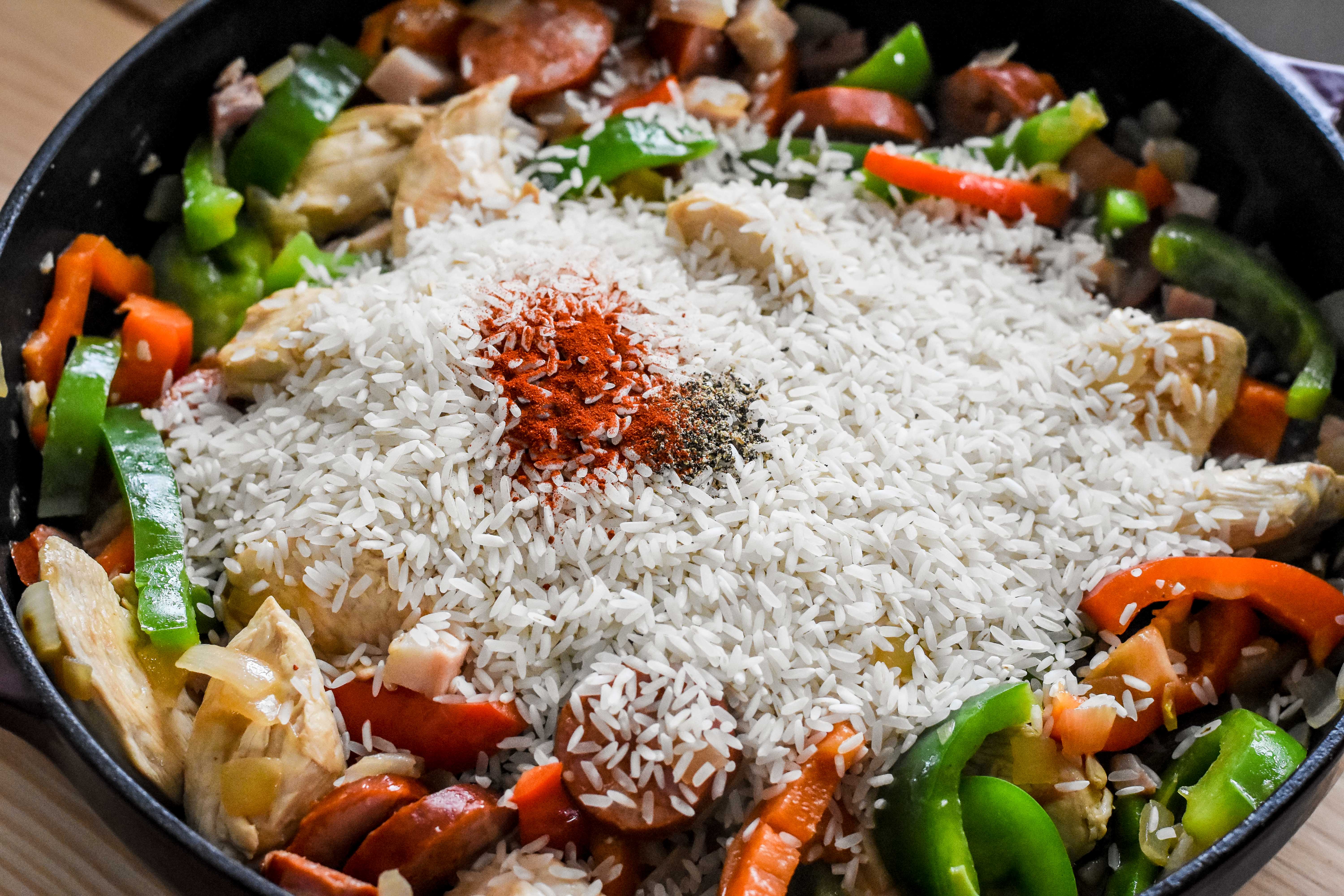 Stir in the rice, black pepper, and Espelette pepper. (Audrey Le Goff)