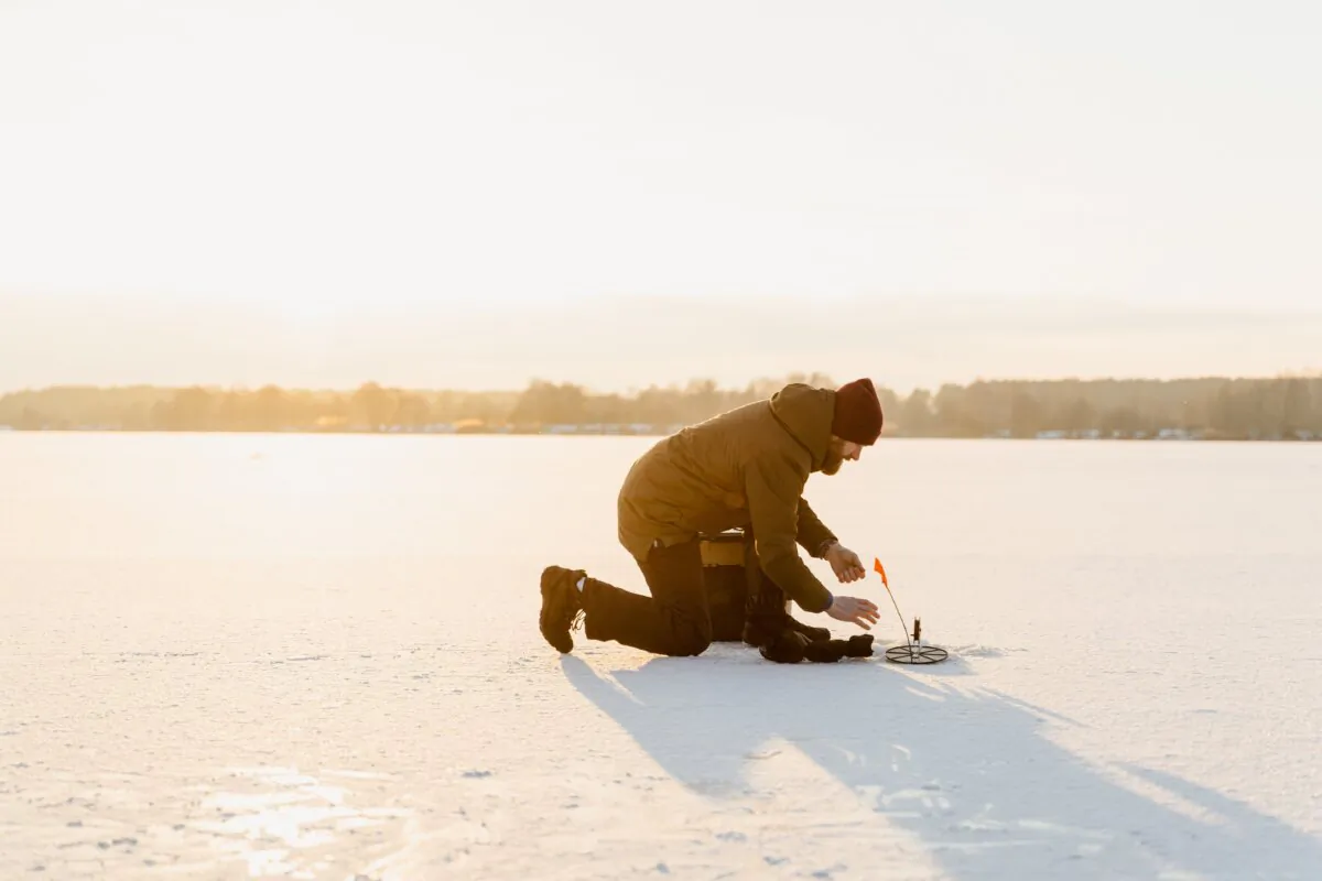 A man checks his fishing line in this file photo. (Tima Miroshnichenko/Pexel)