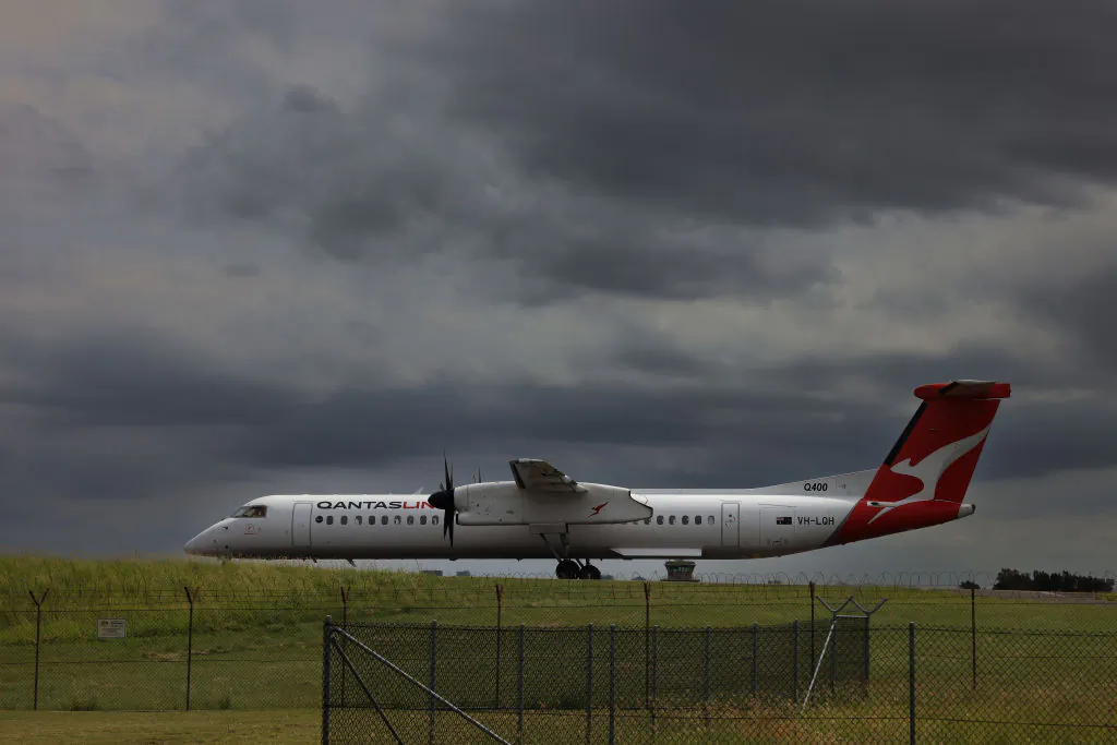 SYDNEY, AUSTRALIA - JANUARY 20: A QantasLink plane taxis on the runway ahead of takeoff at Sydney Airport on January 20, 2024 in Sydney, Australia. Transport Minister Catherine King signed off on a deal that will allow Turkish Airlines to start serving the Australian market, rising to 35 flights a week by 2025. The decision came as the government was under mounting criticism from many for a perception that it was protecting the profits of Qantas and stymying competition in the market by limiting additional capacity for other carriers, such as Qatar Airways. (Photo by Jenny Evans/Getty Images)
