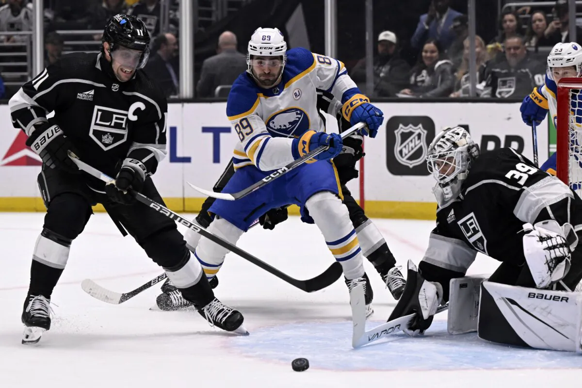 Los Angeles Kings center Anze Kopitar (11) stops a pass intended for Buffalo Sabres right wing Alex Tuch (89) in front of goaltender Cam Talbot (39) during the first period of an NHL hockey game in Los Angeles on Jan. 24, 2024. (Alex Gallardo/AP Photo)