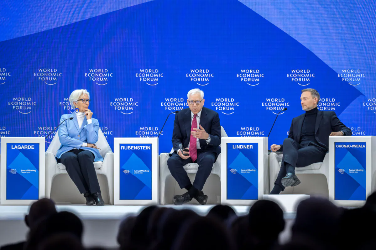 (L-R) President of the European Central Bank (ECB) Christine Lagarde, Co-chairman of the private equity firm of The Carlyle Group David Rubenstein and German Finance Minister Christian Lindner attend a session on the closing day of the World Economic Forum (WEF) annual meeting in Davos, on Jan. 19, 2024. (Fabrice Coffrini /AFP via Getty Images)