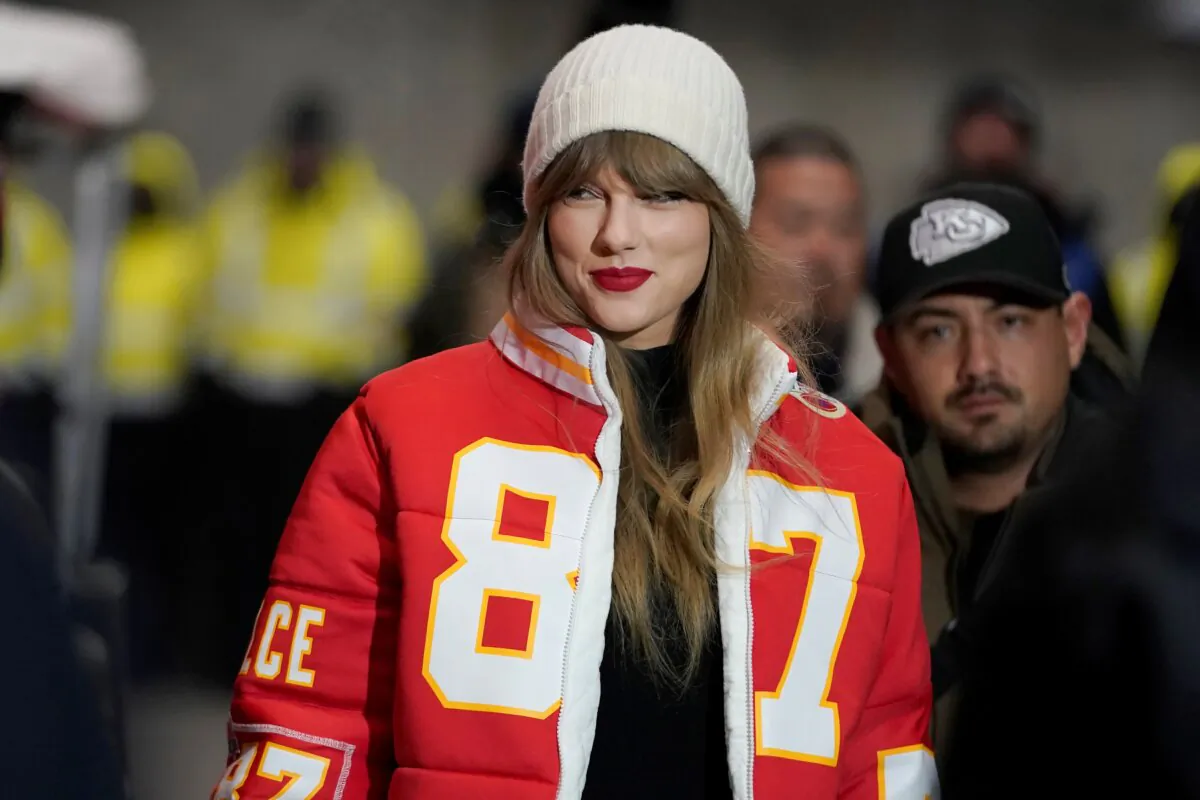 Taylor Swift wears a Kansas City Chiefs tight end Travis Kelce jacket as she arrives before an NFL wild-card playoff football game between the Chiefs and the Miami Dolphins in Kansas City, Mo., on Jan. 13, 2024. (Ed Zurga/AP Photo)