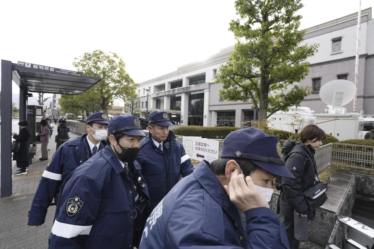 Police officers gather outside the Kyoto District Court in Kyoto, western Japan, on Jan. 25, 2024. (Miki Matsuzaki/Kyodo News via AP)