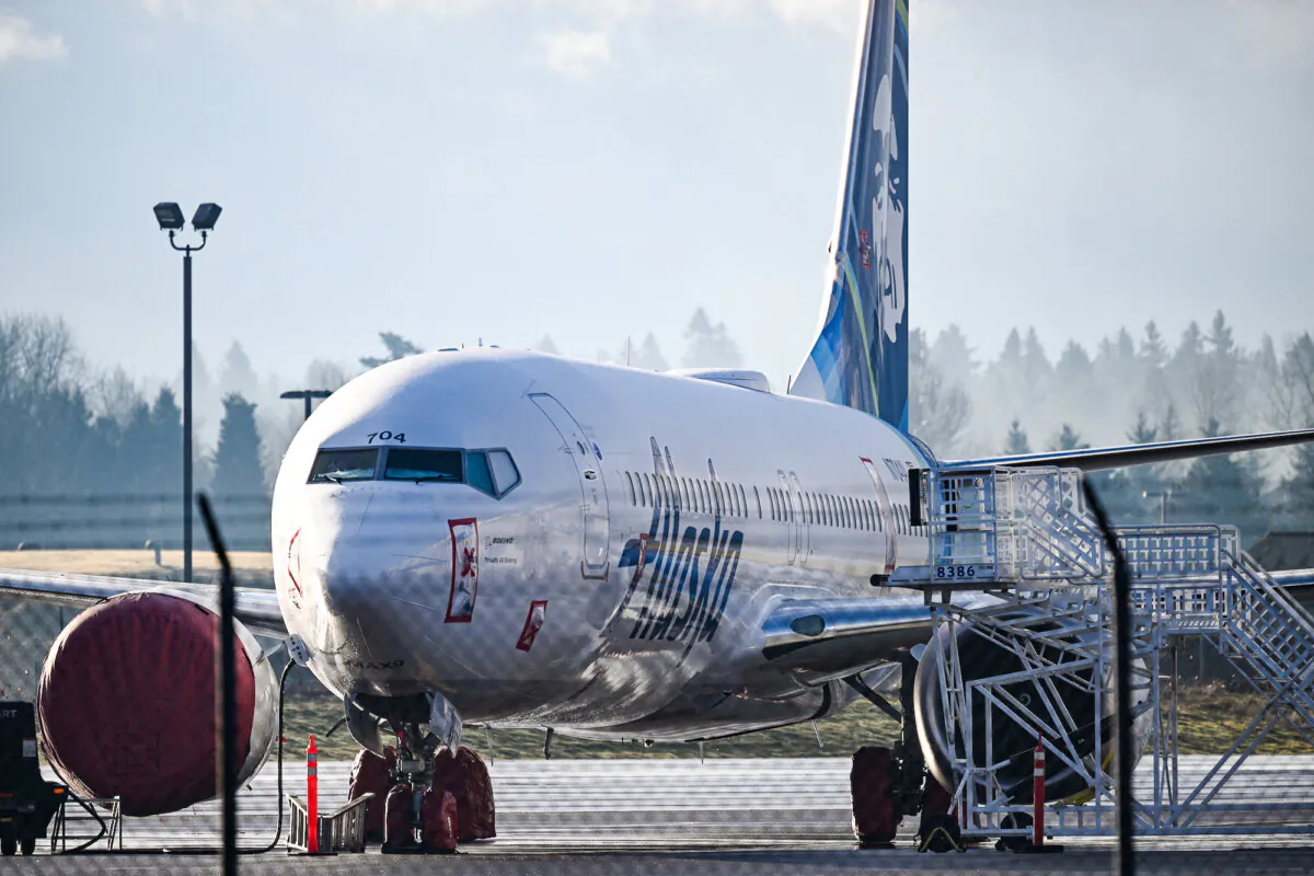 Alaska Airlines N704AL, a 737 Max 9, which made an emergency landing at Portland International Airport on January 5 is parked on the tarmac in Portland, Oregon, on January 23, 2024. One of two door plugs on the emergency exit door blew out shortly after the plane took off from Portland. No fatalities or injuries were reported. The US Federal Aviation Administration (FAA) announced January 11 it was launching a safety probe into Boeing's quality control. (Photo by Patrick T. Fallon / AFP)