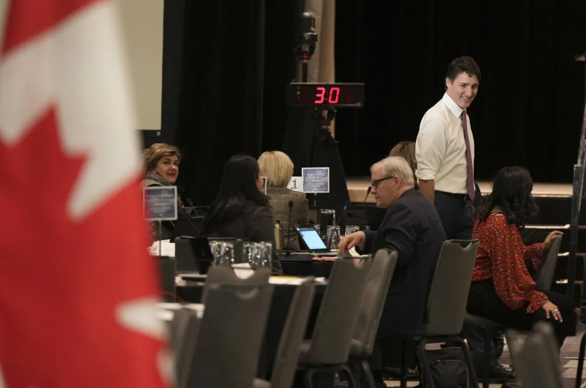 Prime Minister Justin Trudeau greets cabinet ministers at the federal cabinet retreat in Montreal, on Jan. 23, 2024. (The Canadian Press/Christinne Muschi)