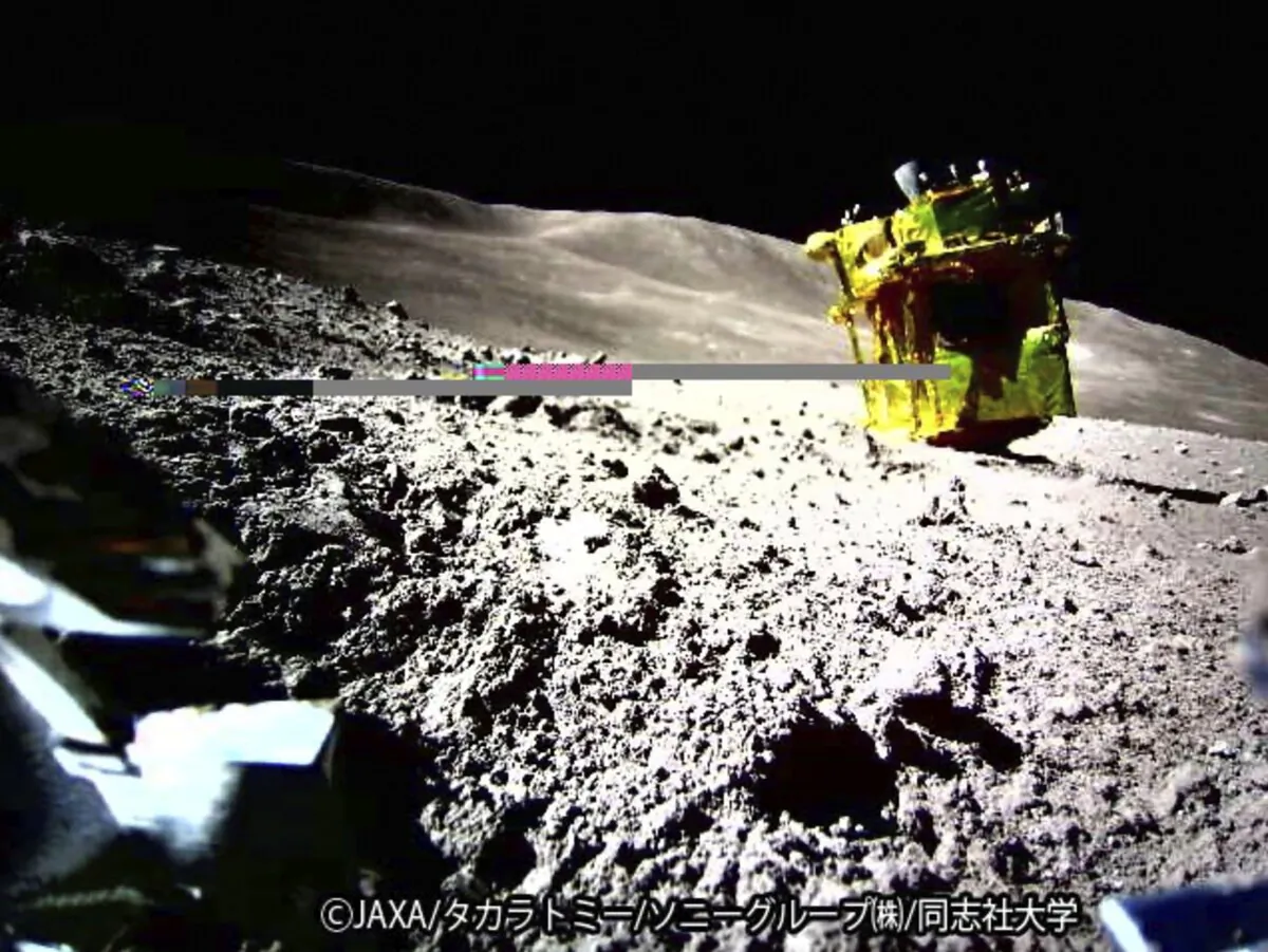 An image taken by a Lunar Excursion Vehicle 2 (LEV-2) of a robotic moon rover called Smart Lander for Investigating Moon, or SLIM, on the moon. (JAXA/Takara Tomy/Sony Group Corporation/Doshisha University via AP)