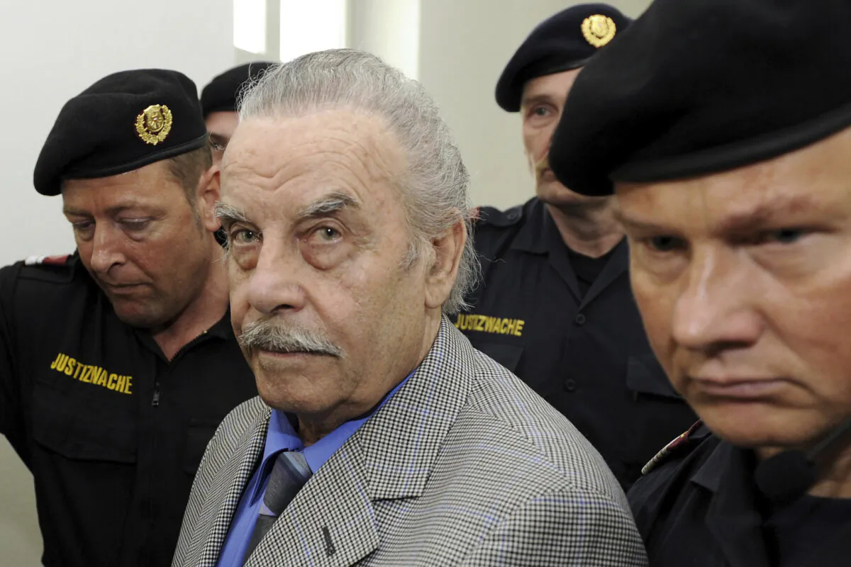 Defendant Josef Fritzl (C) is escorted to the fourth day of his trial in the provincial courthouse in St. Poelten, Austria, on March 19, 2009. (Robert Jaeger/Pool Photo via AP)