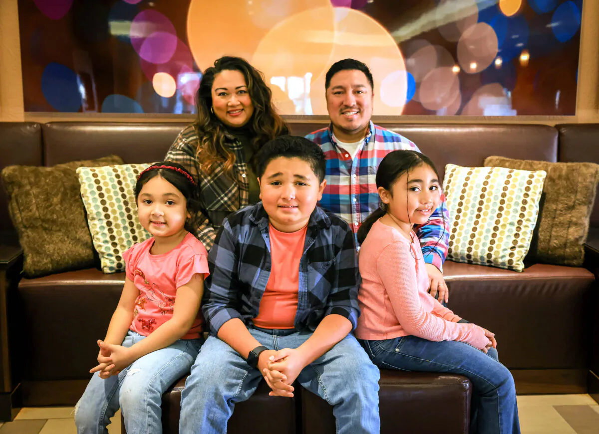Eli German, center, a 10-year-old boy with autism, along with his sisters Aila, 4, left, Arrow, 7, their mother, Aileen and father, Elijah, visit the the Hilton Hotel in Concord, Calif., on Friday, Jan. 5, 2024. The family have stayed in the hotel free of charge through the Visit Concord’s Practice Stay program, which serves traveling families with a loved one diagnosed with Autism Spectrum Disorders. (Ray Chavez/Bay Area News Group)