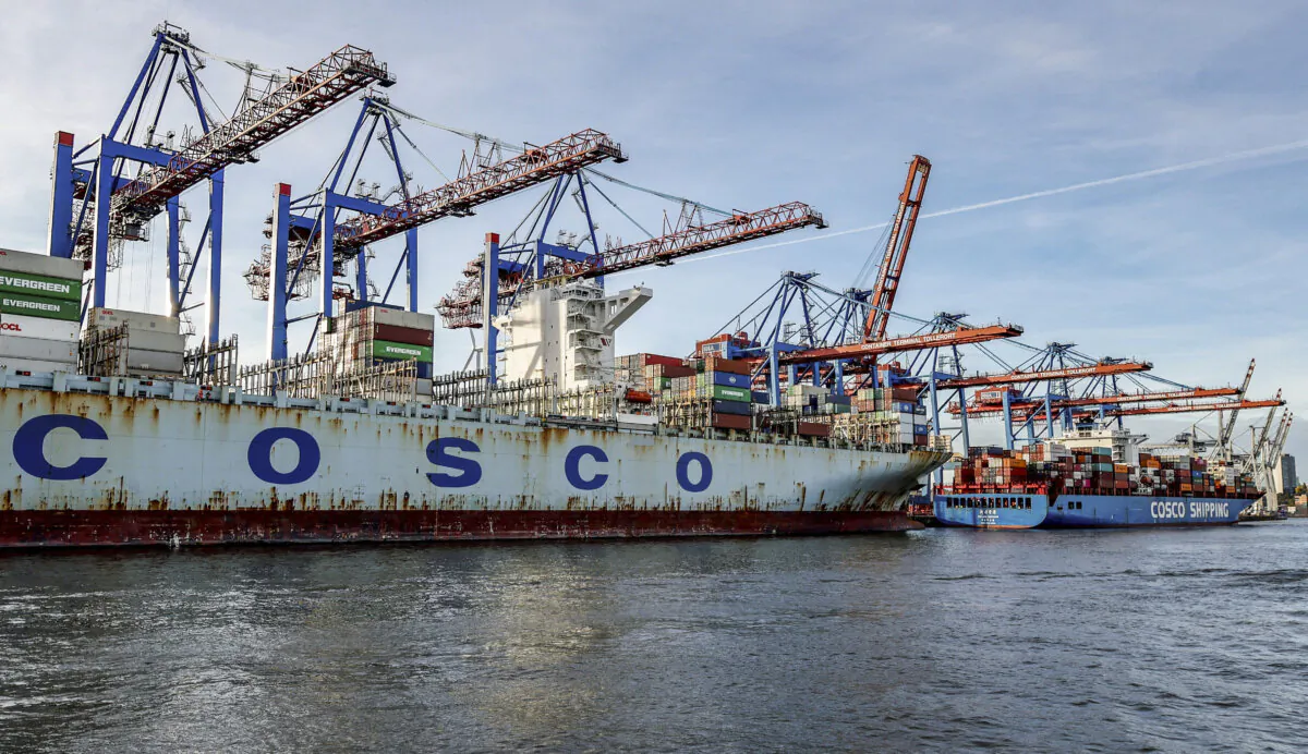 The container ships COSCO Pride (L) and Xin Lian Yun Gang of China COSCO Shipping Corp. are unloaded at the HHLA Tollerort Container Terminal in Hamburg, Germany, on Oct. 26, 2022. (Axel Heimken/AFP via Getty Images)