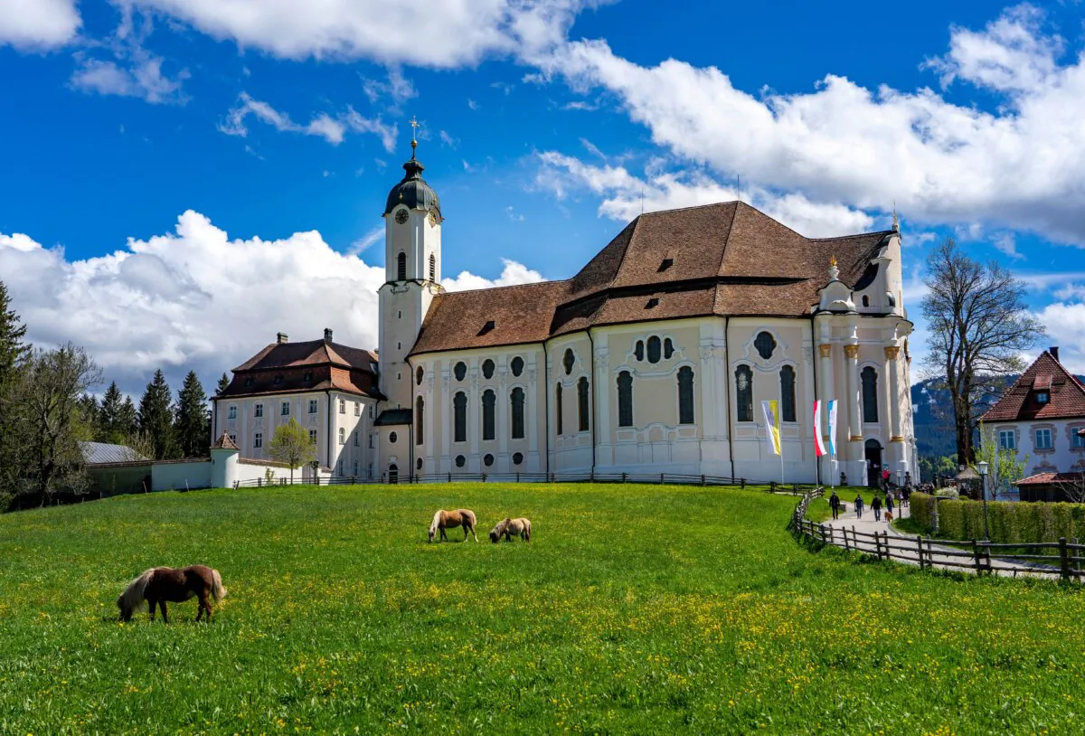 The Church of Wies is along the Romantic Road, a popular route spanning between the German cities of Würzburg and Füssen. The white church with soft, rounded edges blends harmoniously with the countryside and projects a tranquil character. (Frank Lambert/Shutterstock)
