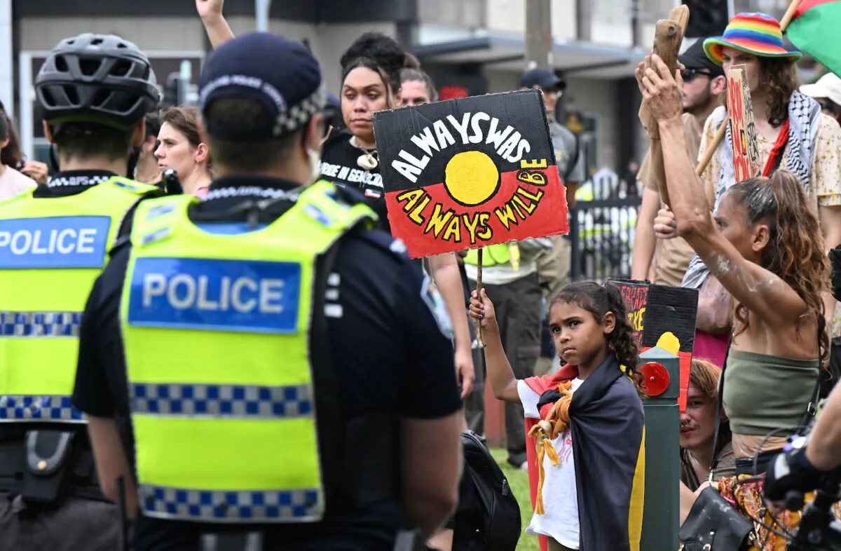 Anti-Australia Day protestors are seen protesting outside the Gabba on Day 2 of the Second Test between Australia and the West Indies at the Gabba in Brisbane, Jan. 26, 2024. (AAP Image/Darren England)