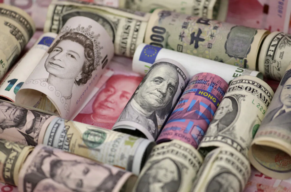 Euro, Hong Kong dollar, U.S. dollar, Japanese yen, British pound, and Chinese 100-yuan banknotes are seen in a picture illustration on Jan. 21, 2016. (Jason Lee/Reuters)