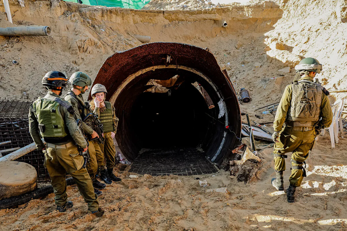 Soldiers stand at the entrance of a tunnel that Hamas reportedly used to attack Israel through the Erez border crossing, in Gaza, on Dec. 15, 2023. (Jack Guez/AFP via Getty Images)