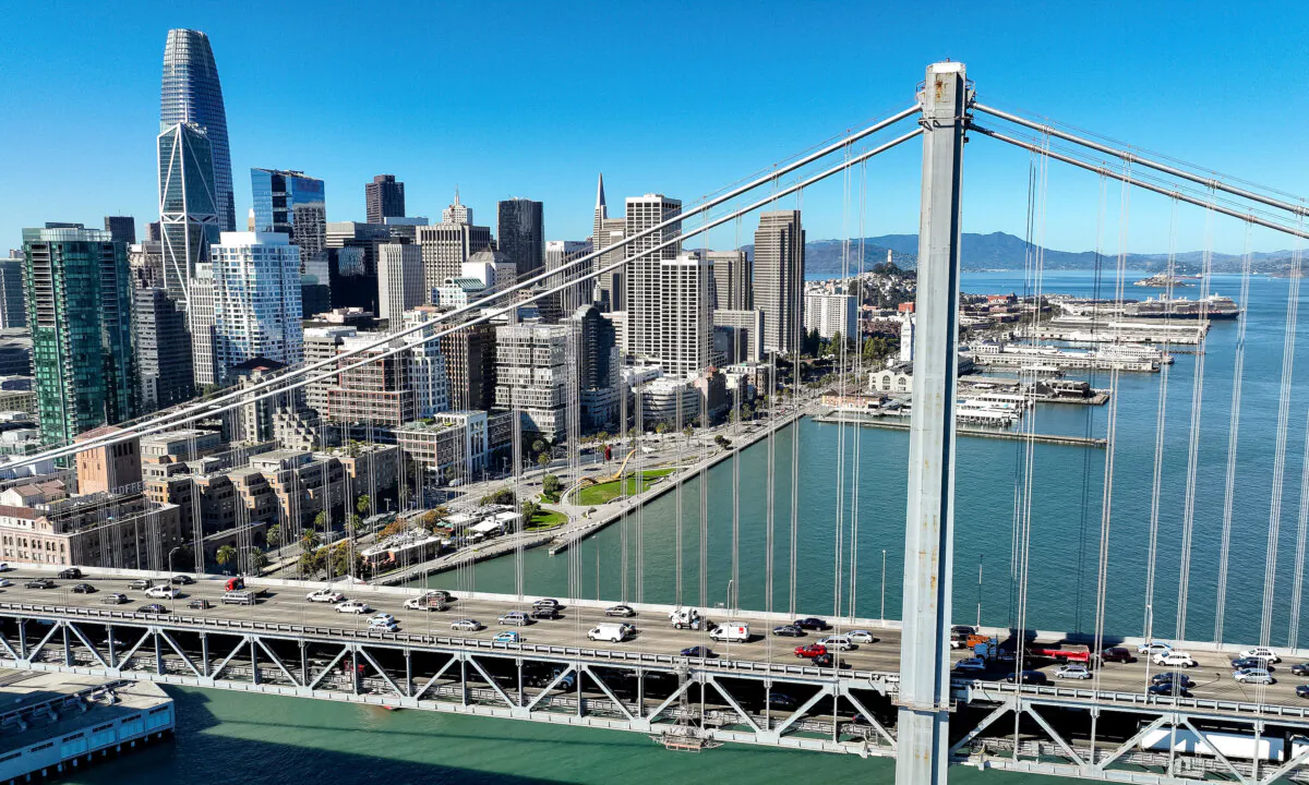 In an aerial view, cars drive by the San Francisco skyline as they cross the San Francisco-Oakland Bay Bridge, on Oct. 27, 2022. (Justin Sullivan/Getty Images)