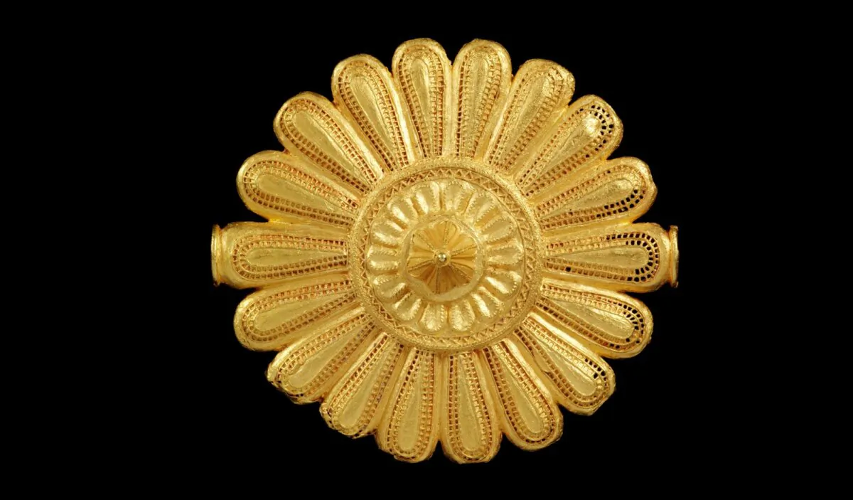 A view of a cast gold badge, worn by the Asantehene's or king's 'soul washer' as a badge of office, originating from Ghana, in London on Jan. 25, 2024. (Dominic Naish, Victoria and Albert Museum, London via AP)