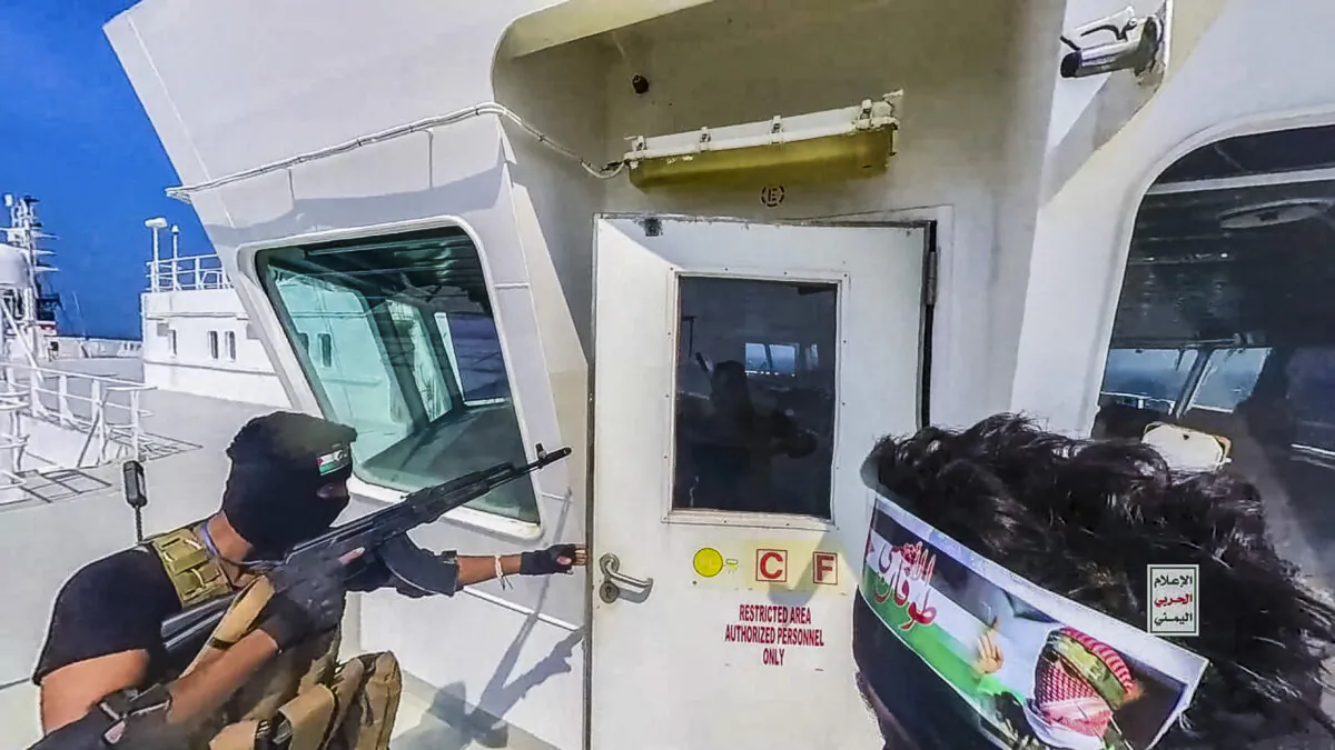 INTERNATIONAL WATERS RED SEA, YEMEN - NOVEMBER 20: This handout screen grab captured from a video shows Yemen's Houthi fighters' takeover of the Galaxy Leader Cargo in the Red Sea coast off Hudaydah, on November 20, 2023 in the Red Sea, Yemen. On Monday, the Houthi movement in Yemen released footage and photos of the Houthi-run coastguard taking over the Israeli-linked Galaxy Leader Vessel in the Red Sea, which had 52 people onboard. Galaxy Leader is owned by Galaxy Maritime Ltd in the Isle of Man and is linked to Israeli businessman Abraham Ungar through Ray Car Carriers. (Photo by Houthi Movement via Getty Images)