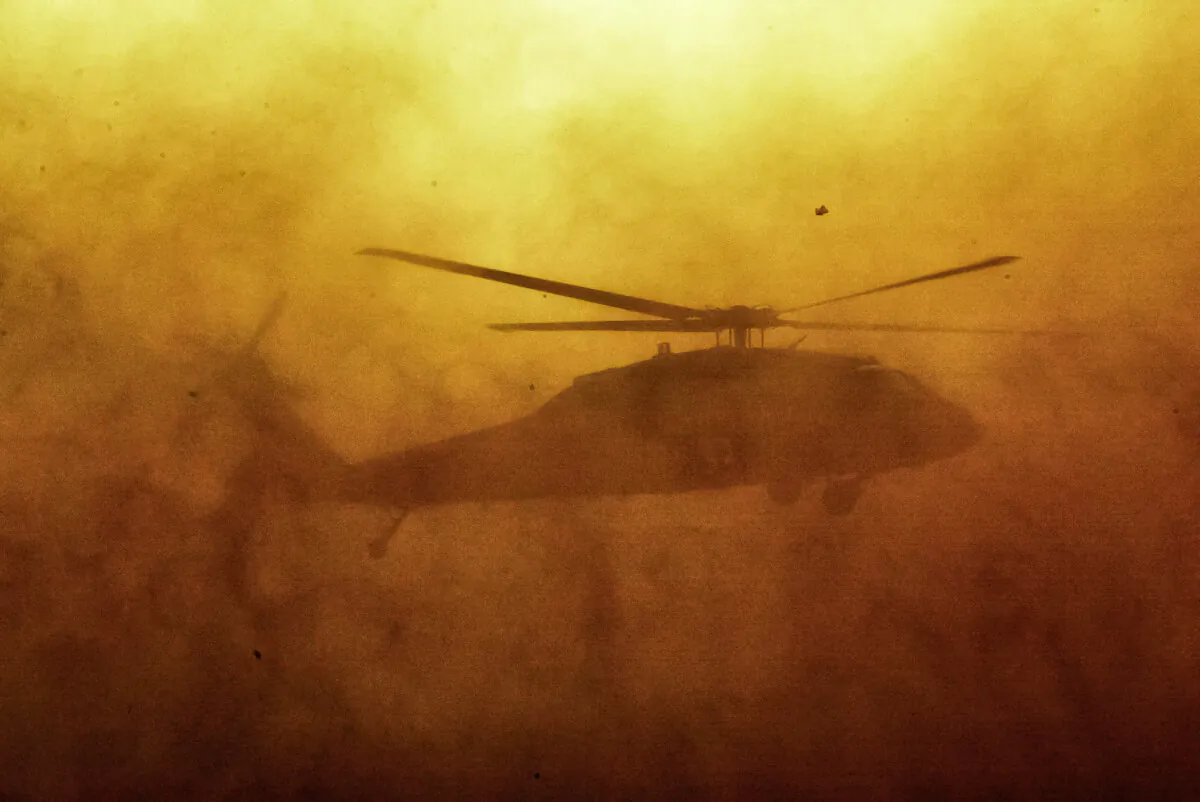 AN NASIRIYAH, IRAQ - APRIL 10: A U.S. Army Blackhawk creates a cloud of dust as it lands at Dalil Air Base April 10, 2003 in near An Nasiriyah, Iraq. The 101st. The former airport was seized by the U.S. Military and is now used by coalition forces. (Photo by Mark Wilson/Getty Images)