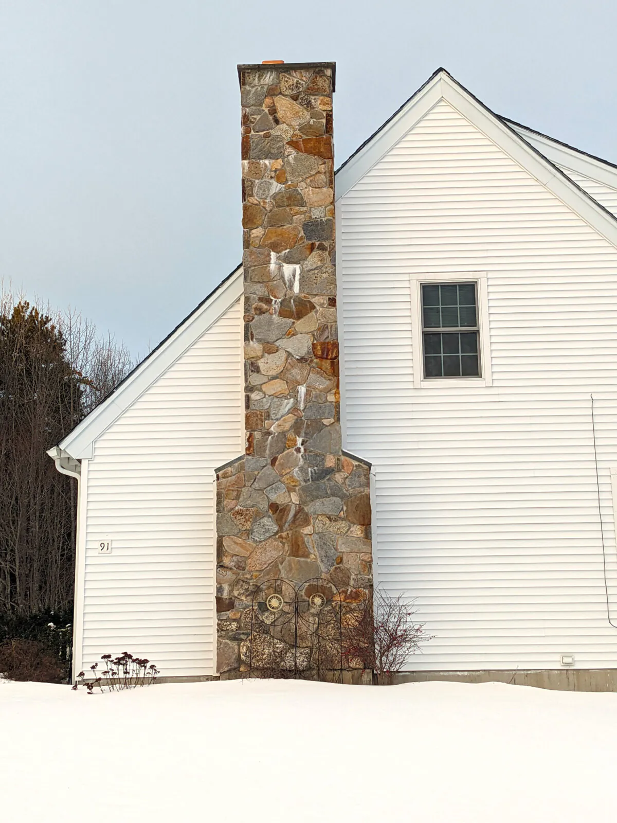 This chimney is not watertight. Look at the white efflorescence stain. Water is entering the chimney higher up and then leaking out just above the white salt deposits. (Tim Carter/Tribune Content Agency)