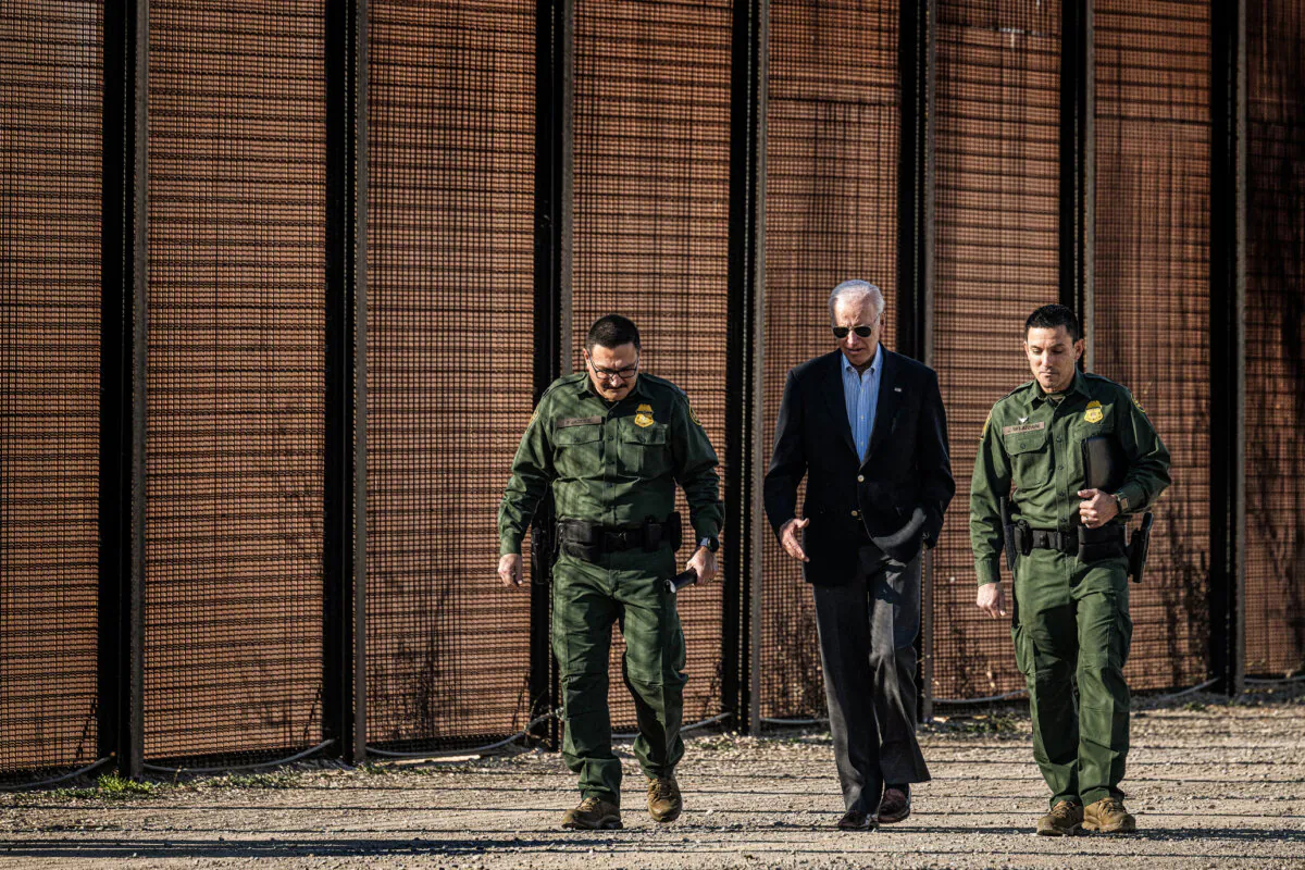 President Joe Biden speaks with U.S. Customs and Border Protection officers as he visits the U.S.–Mexico border in El Paso, Texas, on Jan. 8, 2023. (Jim Watson/AFP via Getty Images)