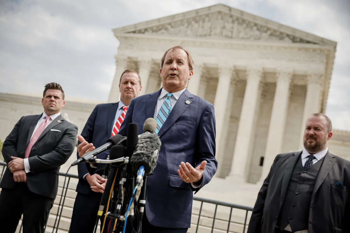 Texas Attorney General Ken Paxton talks to reporters at the Washington Supreme Court, on April 26, 2022. (Chip Somodevilla/Getty Images)