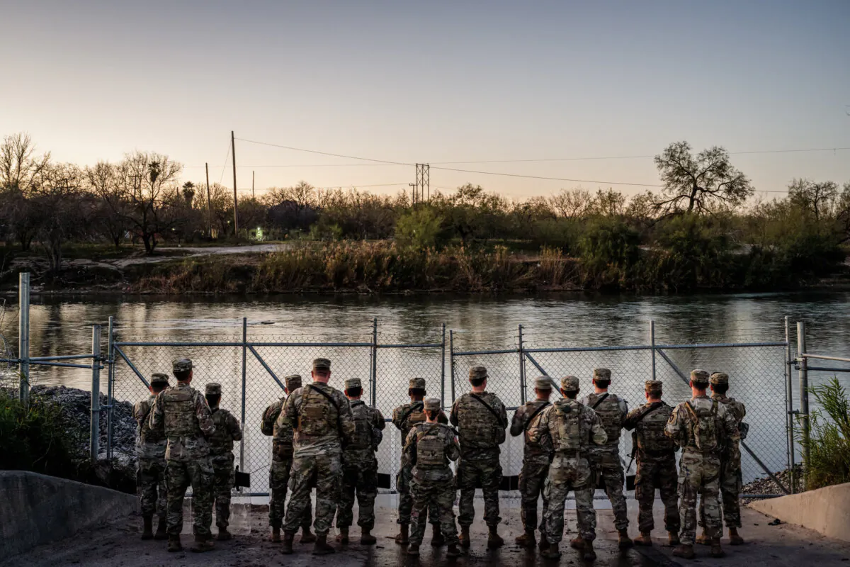 National Guard soldiers stand guard on the banks of the Rio Grande river at Shelby Park in Eagle Pass, Texas, on Jan. 12, 2024. (Brandon Bell/Getty Images)