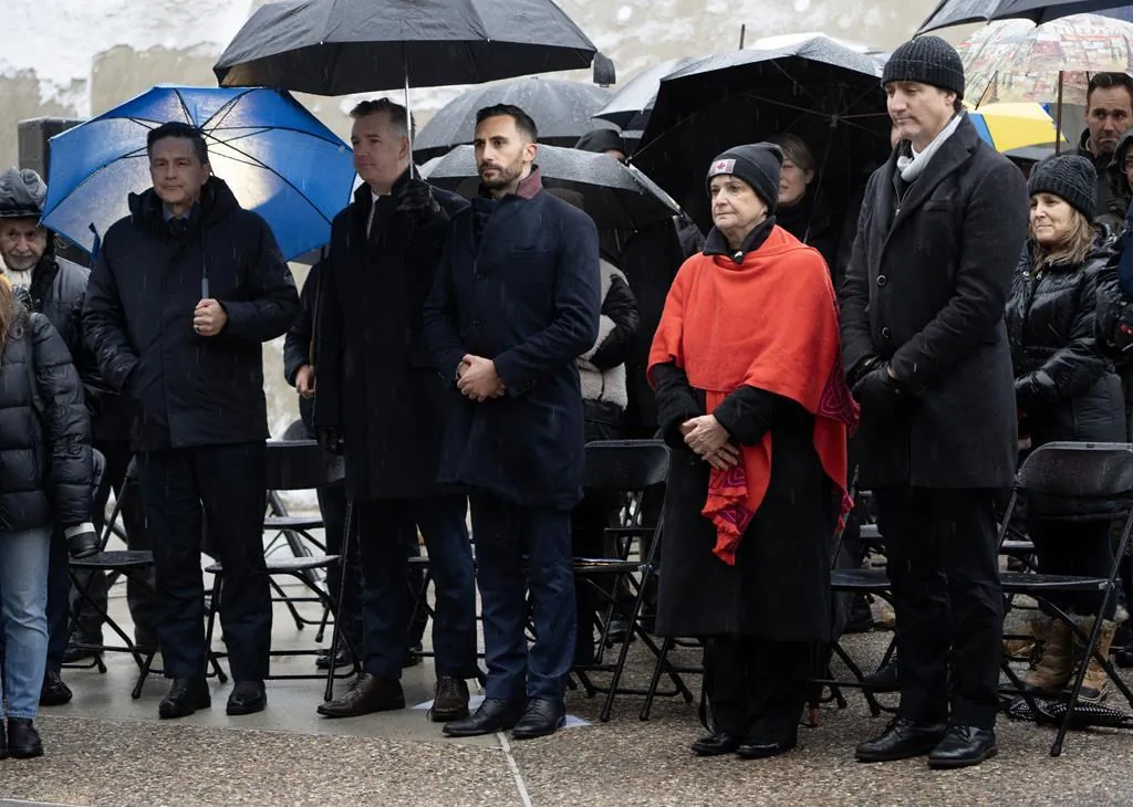 (R-L) Prime Minister Justin Trudeau stands with Canada's Special Envoy on Preserving Holocaust Remembrance and Combatting Antisemitism Deborah Lyons, Ontario Minister of Education Stephen Lecce, Conservative MP Michael Barrett, and Conservative Leader Pierre Poilievre during a service marking the 79th anniversary of the liberation of the Auschwitz-Birkenau concentration camp at the National Holocaust Memorial, in Ottawa on Jan. 26, 2024. (The Canadian Press/Adrian Wyld)
