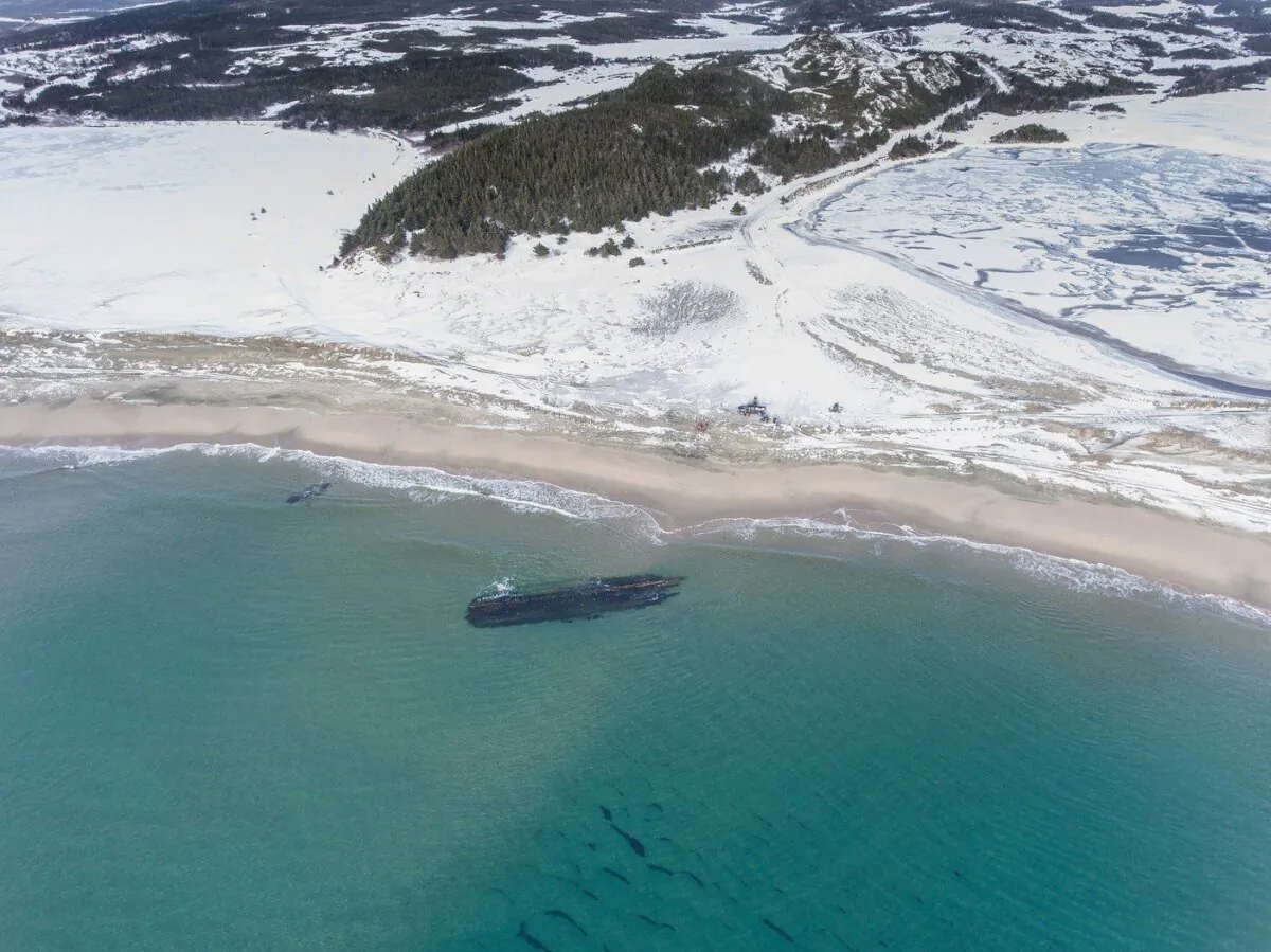 The massive, overturned hull of a seemingly ancient ship has appeared without warning along Newfoundland's southwestern tip as shown in this handout image provided by Corey Purchase. (The Canadian Press/HO-Corey Purchase)
