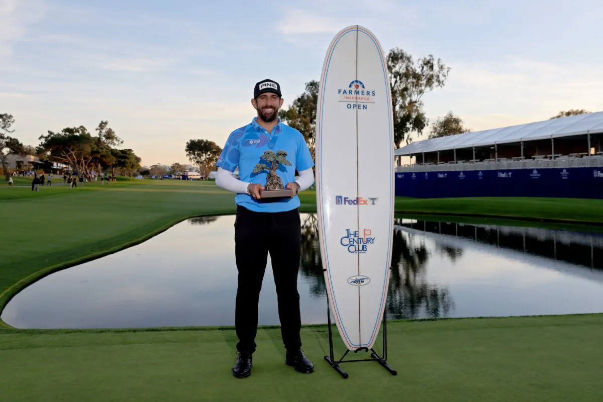 Matthieu Pavon of France poses with the trophy after winning the Farmers Insurance Open at Torrey Pines South Course in La Jolla, Calif., on Jan. 27, 2024. (Orlando Ramirez/Getty Images)