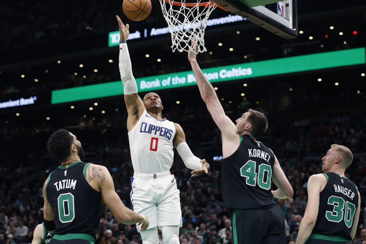 Los Angeles Clippers' Russell Westbrook (0) shoots against Boston Celtics' Jayson Tatum, (L) and Luke Kornet (40) during the first half of an NBA basketball game in Boston on Jan. 27, 2024. (Michael Dwyer/AP Photo)