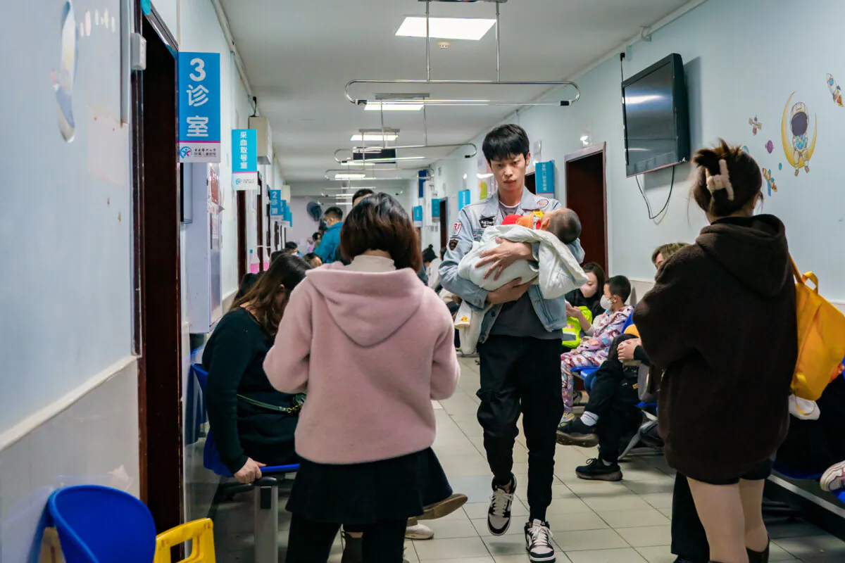 Parents with children suffering from respiratory diseases lineup at a children's hospital in Chongqing, China, on Nov. 23, 2023. (CFOTO/Future Publishing via Getty Images)