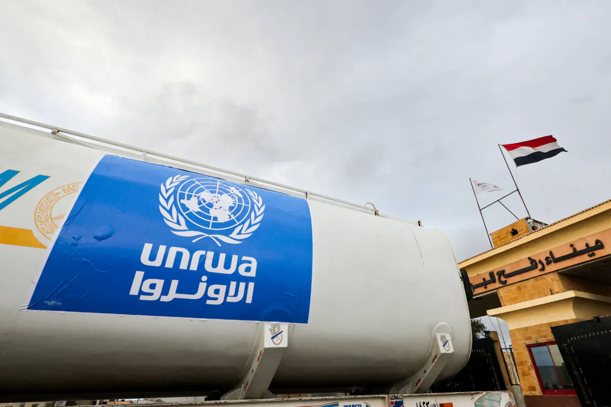 A truck marked with United Nations Relief and Works Agency (UNRWA) logo crosses into Egypt from Gaza at the Rafah border crossing during a temporary truce between Hamas and Israel, on Nov. 27, 2023. (Amr Abdallah Dalsh/Reuters)