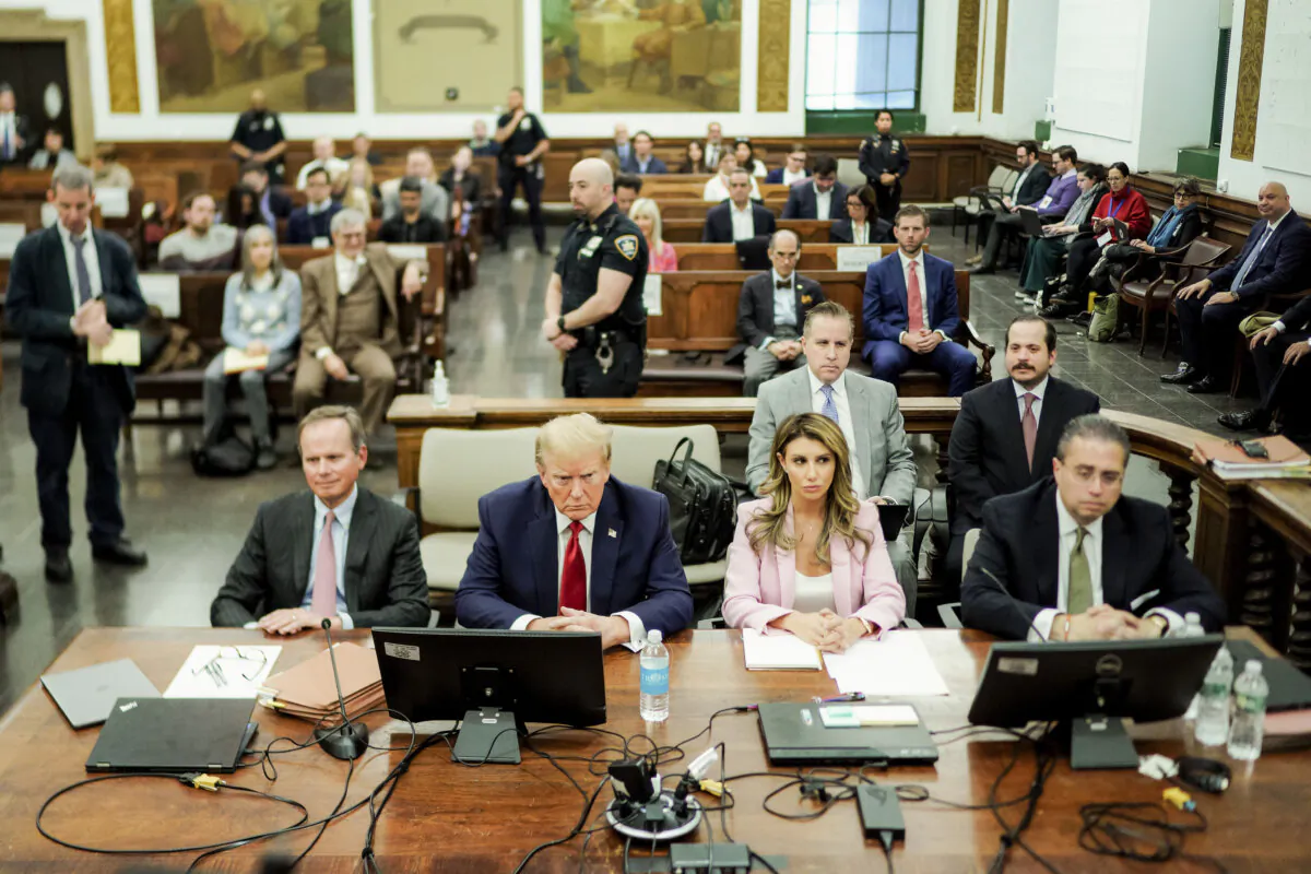 Former President Donald Trump sits at the defense table with his attorneys Christopher Kise (L) and Alina Habba (2nd-R) in the New York State Supreme Court in New York City on Dec. 7, 2023. (Eduardo Munoz Alvarez-Pool/Getty Images)