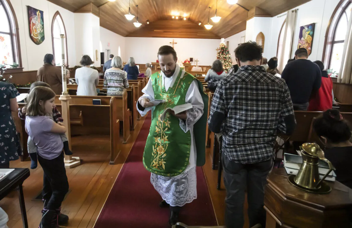 Father Aaron Solberg holds a Sunday service after six people were killed in a plane crash in Fort Smith, N.W.T., on Jan. 28, 2024. (The Canadian Press/Jason Franson)