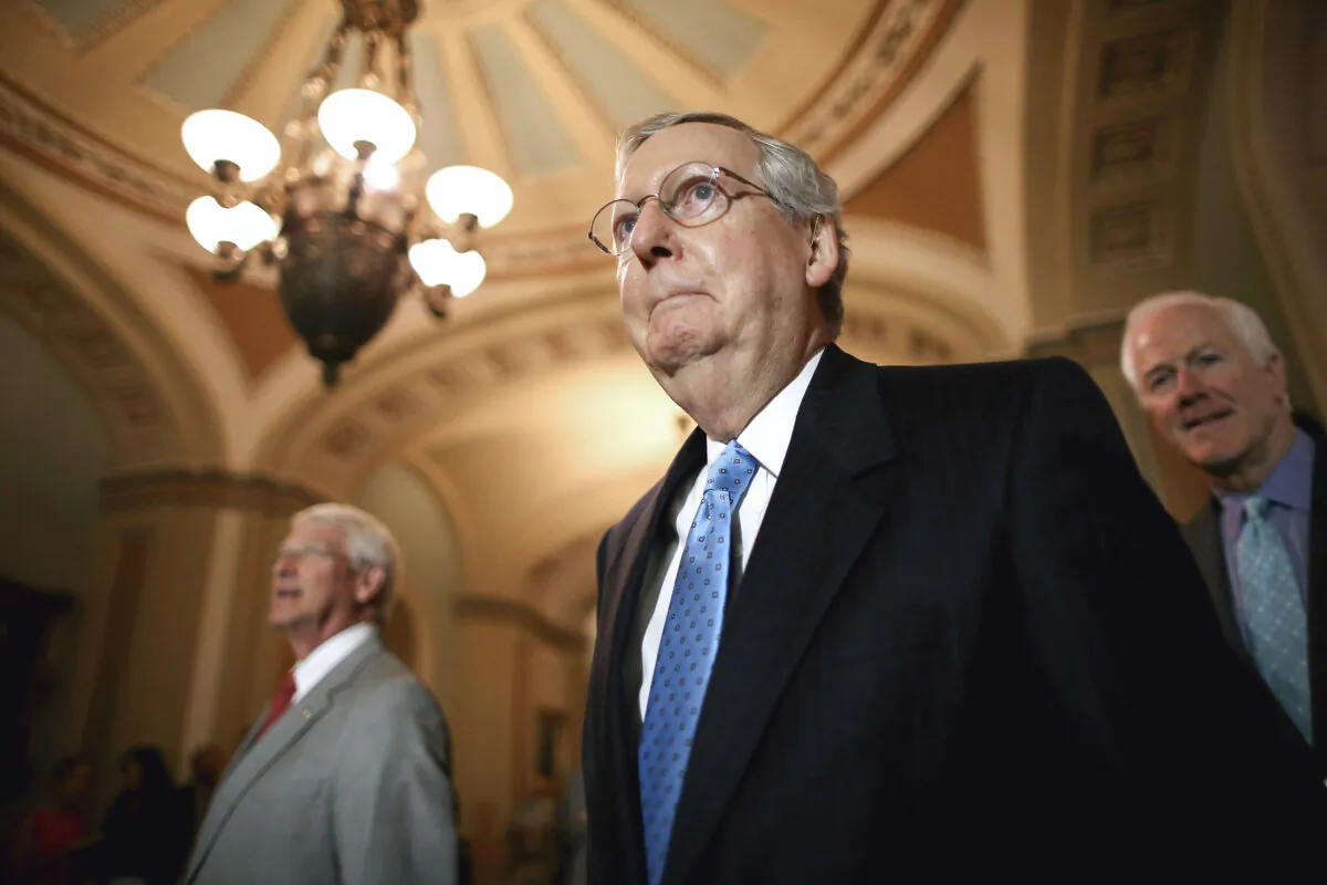 Senate Majority Leader Mitch McConnell (R-Ky.) (C), Sen. Roger Wicker (R-Miss.) (L) and Sen. John Cornyn (R-Texas) prepare to speak to reporters after the weekly Senate Republican policy luncheon at the U.S. Capitol in Washington, D.C., on Aug. 4, 2015. (Chip Somodevilla/Getty Images)