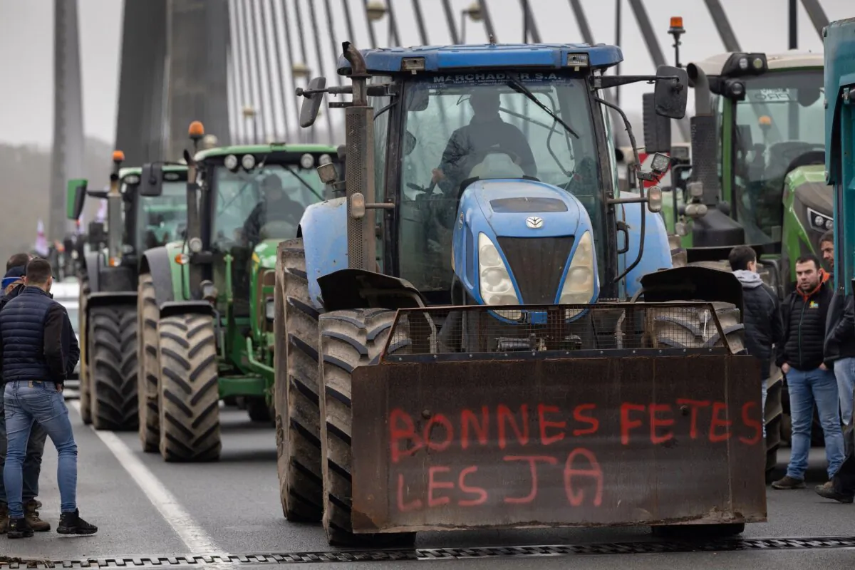 Farmers block the Iroise bridge in Brest, France, on Jan. 24, 2024, as they protest against taxation and falling incomes. (Fred Tanneau/AFP)