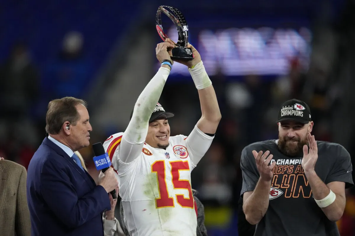 Kansas City Chiefs quarterback Patrick Mahomes (15) holds up the Lamar Hunt Trophy after the AFC Championship NFL football game against the Baltimore Ravens in Baltimore on Jan. 28, 2024. (Nick Wass/AP Photo)
