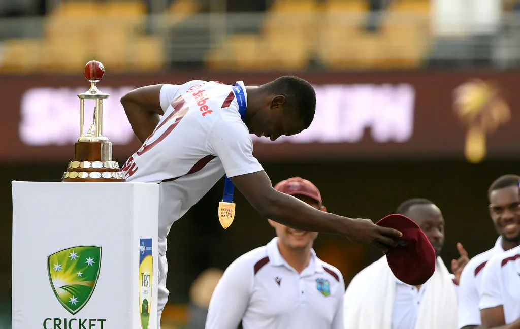 Shamar Joseph of the West Indies takes a bow as he celebrates winning the man of the match and man of the series awards during day four of the Second Test match in the series between Australia and West Indies at The Gabba in Brisbane, Australia, on Jan. 28, 2024. (Bradley Kanaris/Getty Images)