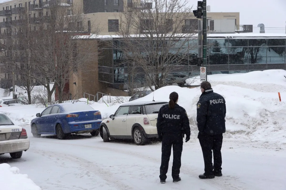 Police attend the scene of a shooting at a Quebec City mosque on Jan. 30, 2017. (The Canadian Press/Paul Chiasson)