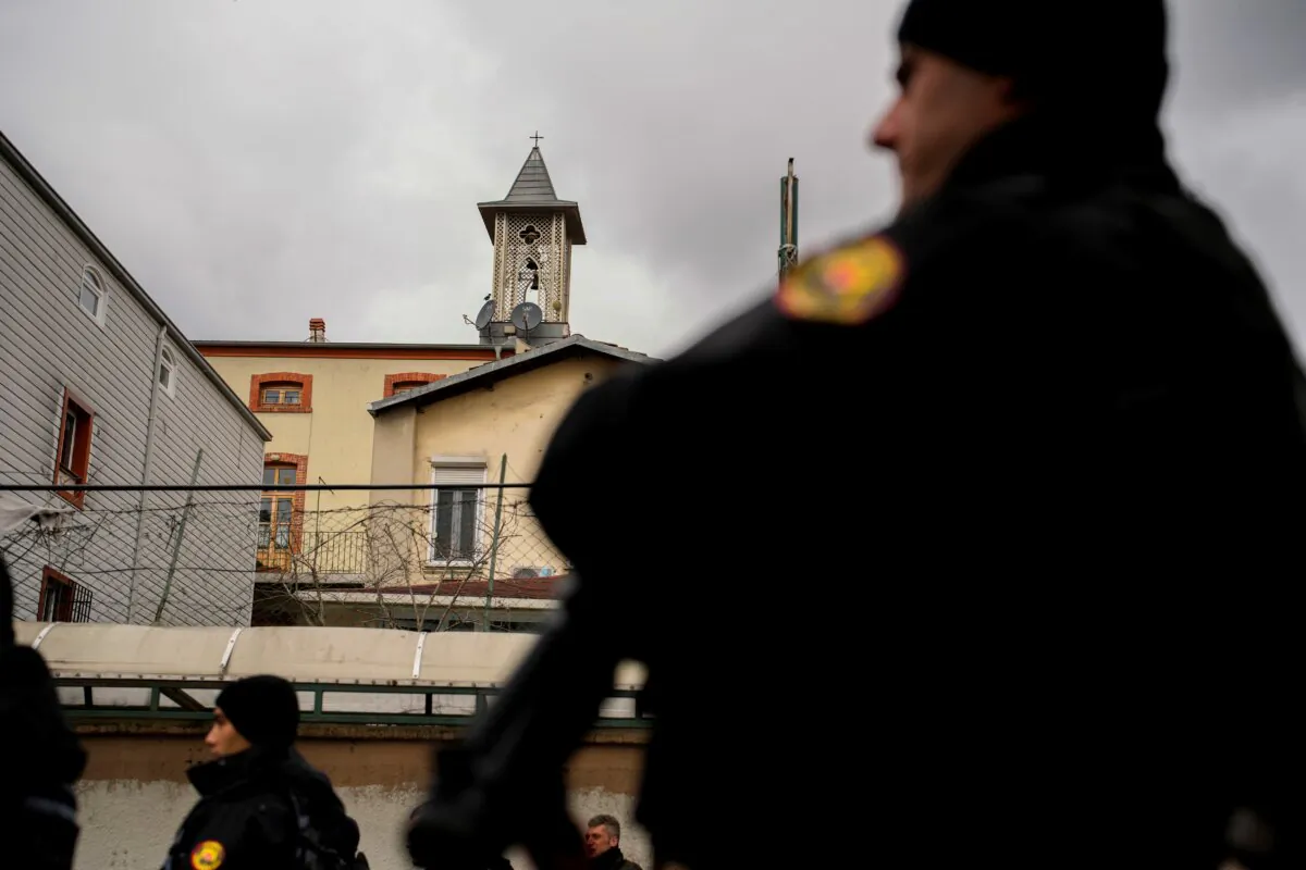 Turkish police officers stand guard in a cordoned off area outside the Santa Maria church, in Istanbul on Jan. 28, 2024. (Emrah Gurel/AP Photo)