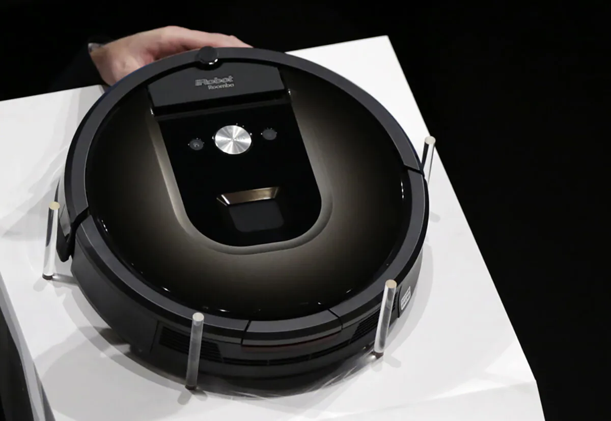 A Roomba 980 vacuum cleaning robot is presented during a presentation in Tokyo on Sept. 29, 2015. (Eugene Hoshiko/AP Photo)