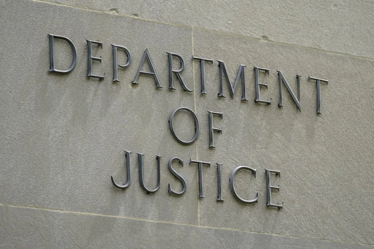 An exterior sign is photographed outside the Robert F. Kennedy Department of Justice building in Washington on May 4, 2021. (The Canadian Press/AP-Patrick Semansky)