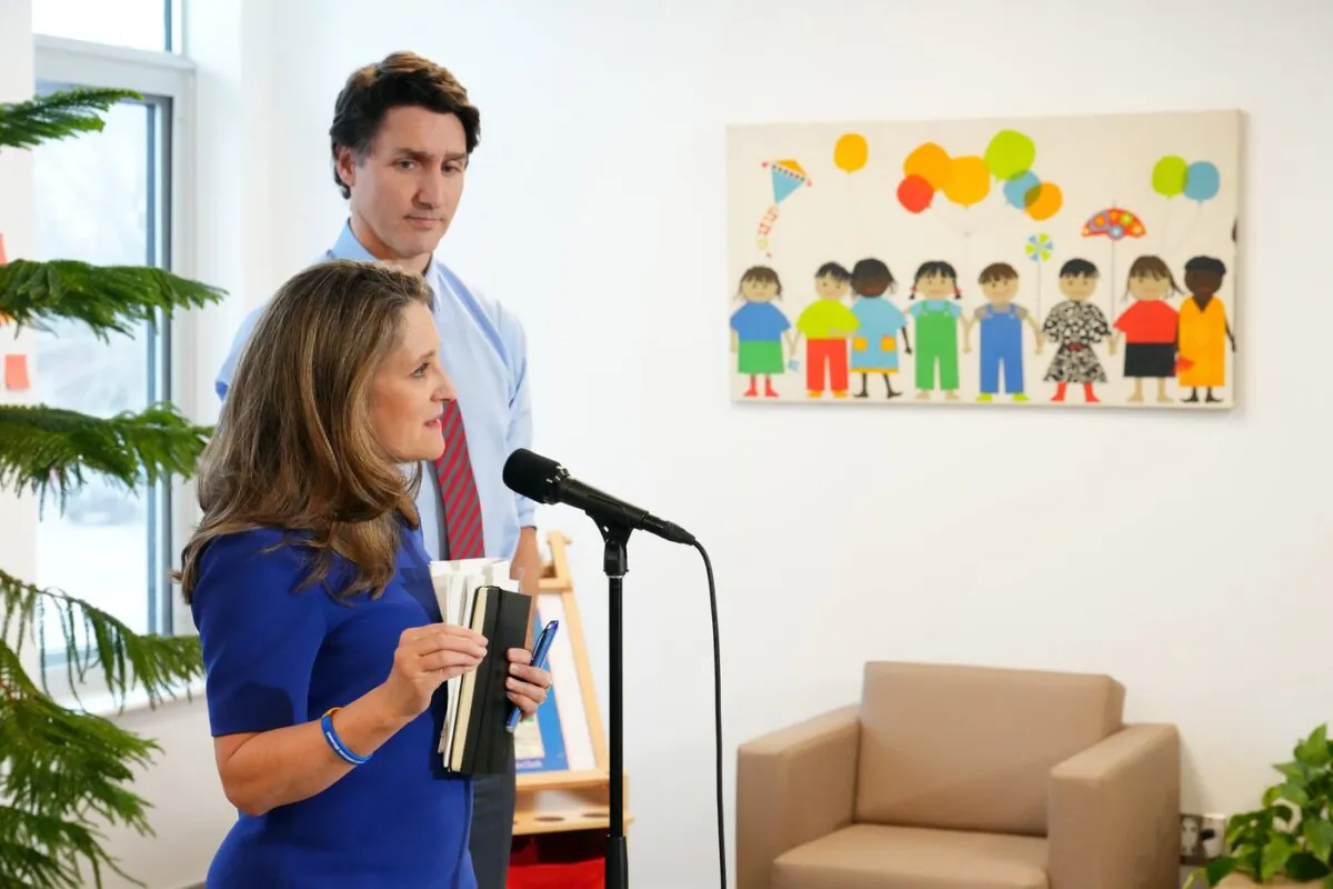 Prime Minister Justin Trudeau looks on as Finance Minister Chrystia Freeland speaks at a press conference at a local child care centre in Ottawa, on March 29, 2023. (The Canadian Press/Sean Kilpatrick)