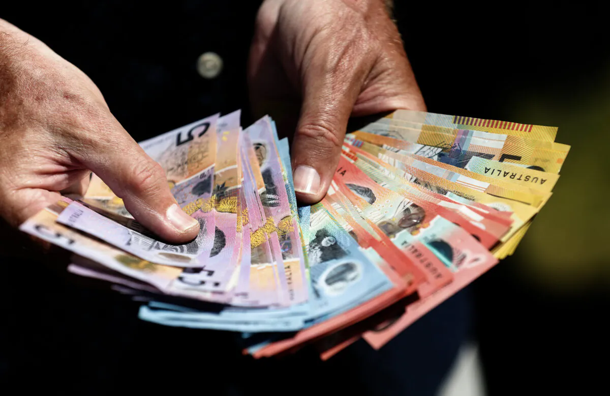 Australian banknotes being handled at Melbourne Cup Day at Flemington Racecourse in Melbourne, Australia on Nov. 7, 2023. (AAP Image/Con Chronis)