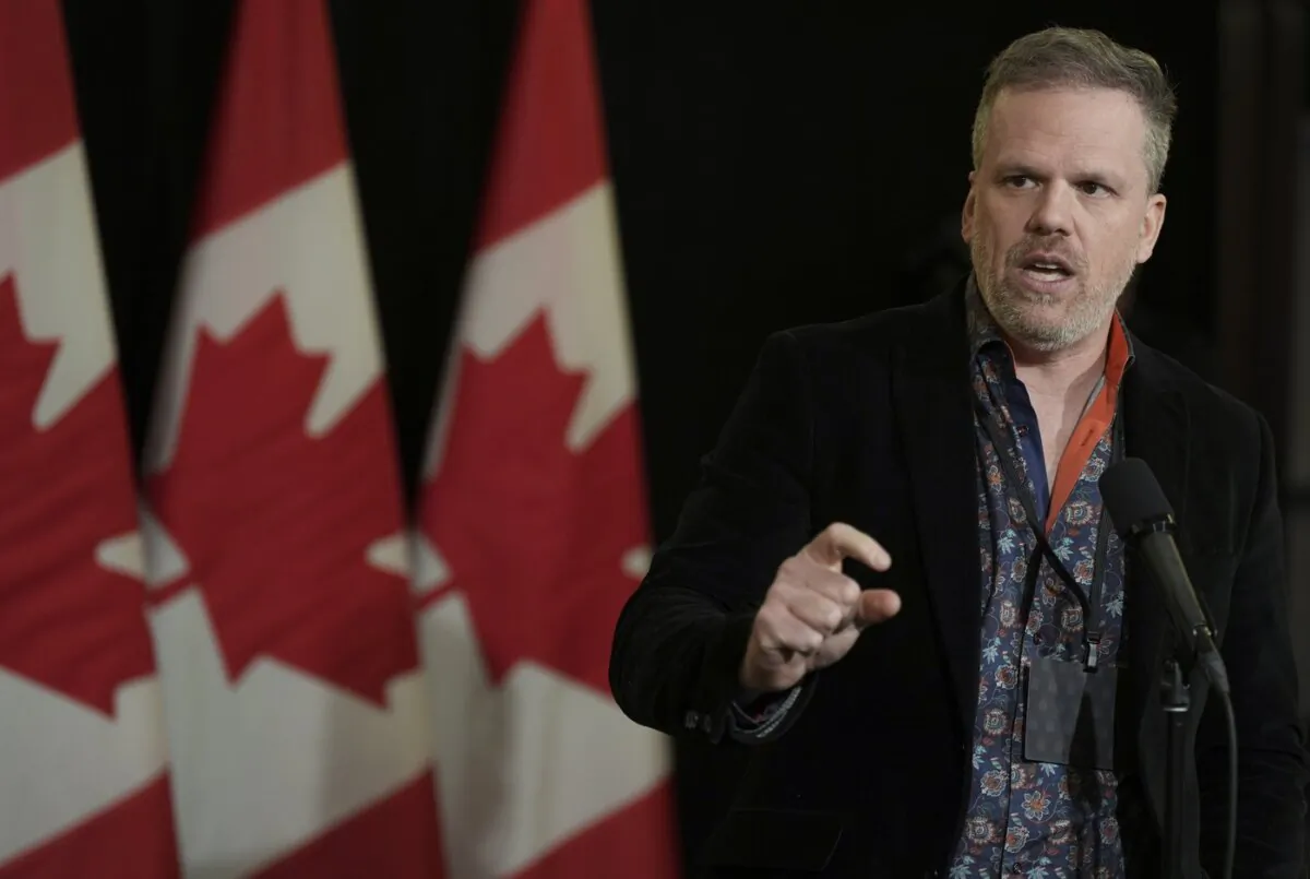 Health Minister Mark Holland speaks to the media during the federal cabinet retreat in Montreal, on Jan. 22, 2024. (The Canadian Press/Christinne Muschi)