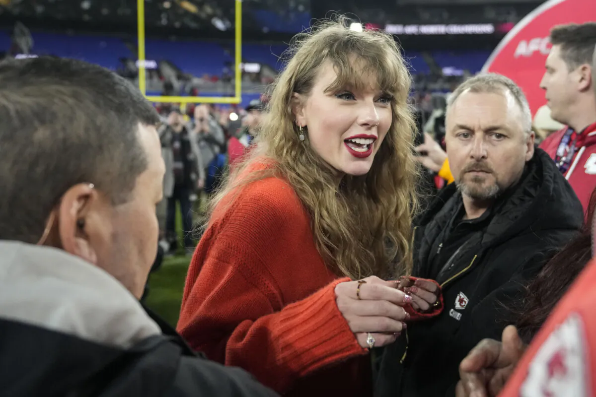 Taylor Swift speaks with people on the field after an AFC Championship NFL football game between the Baltimore Ravens and the Kansas City Chiefs in Baltimore on Jan. 28, 2024. (Alex Brandon/AP Photo)