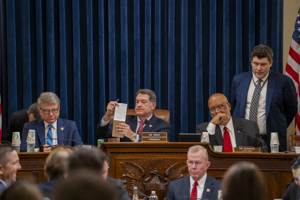 (L-R) Rep. Michael McCaul (R-Texas), Chairman of the House Committee on Homeland Security Rep. Mark Green (R-Tenn.), and Ranking Member Rep. Bennie Thompson (D-Miss.) meet with other lawmakers to mark up articles of impeachment against Secretary of the Department of Homeland Security (DHS) Alejandro Mayorkas in Washington on Jan. 30, 2024. (Madalina Vasiliu/The Epoch Times)