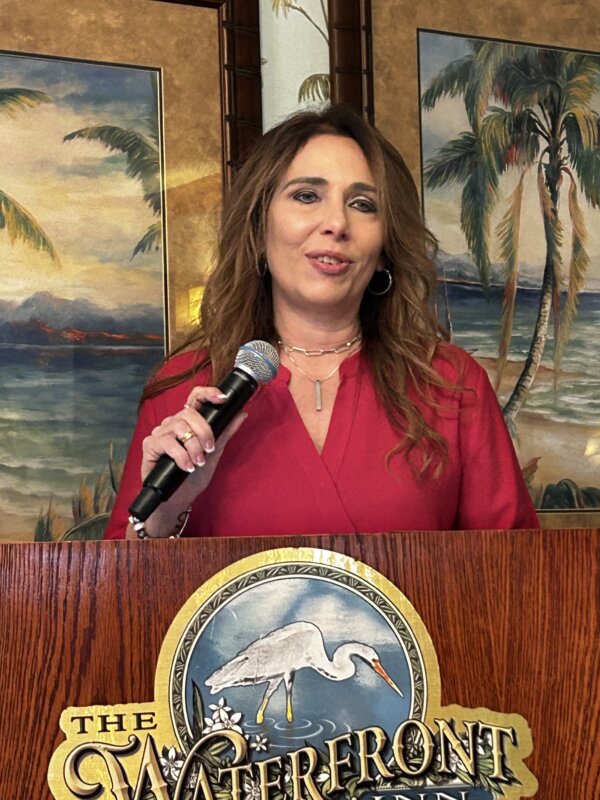 Michelle Utter, a healthcare professional, speaks at a press conference at The Villages in Florida