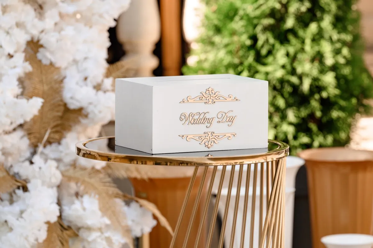 It is quite proper to give a wedding gift of cash or a gift certificate to the store where the couple is registered. (Andrii Anna photographers/Shutterstock)