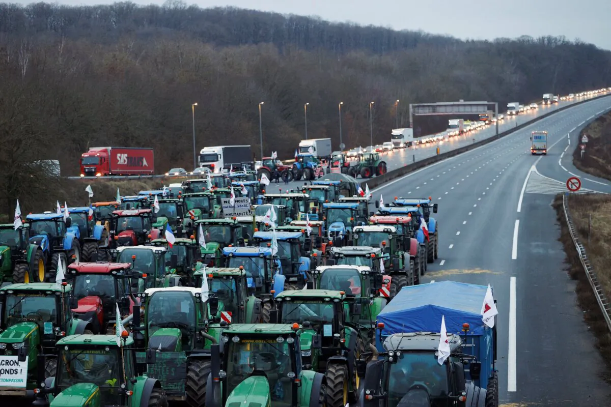 French farmers block a highway with their tractors during a protest over price pressures, taxes and green regulation, in Longvilliers, near Paris, France, on Jan. 30, 2024. (Abdul Saboor/Reuters)