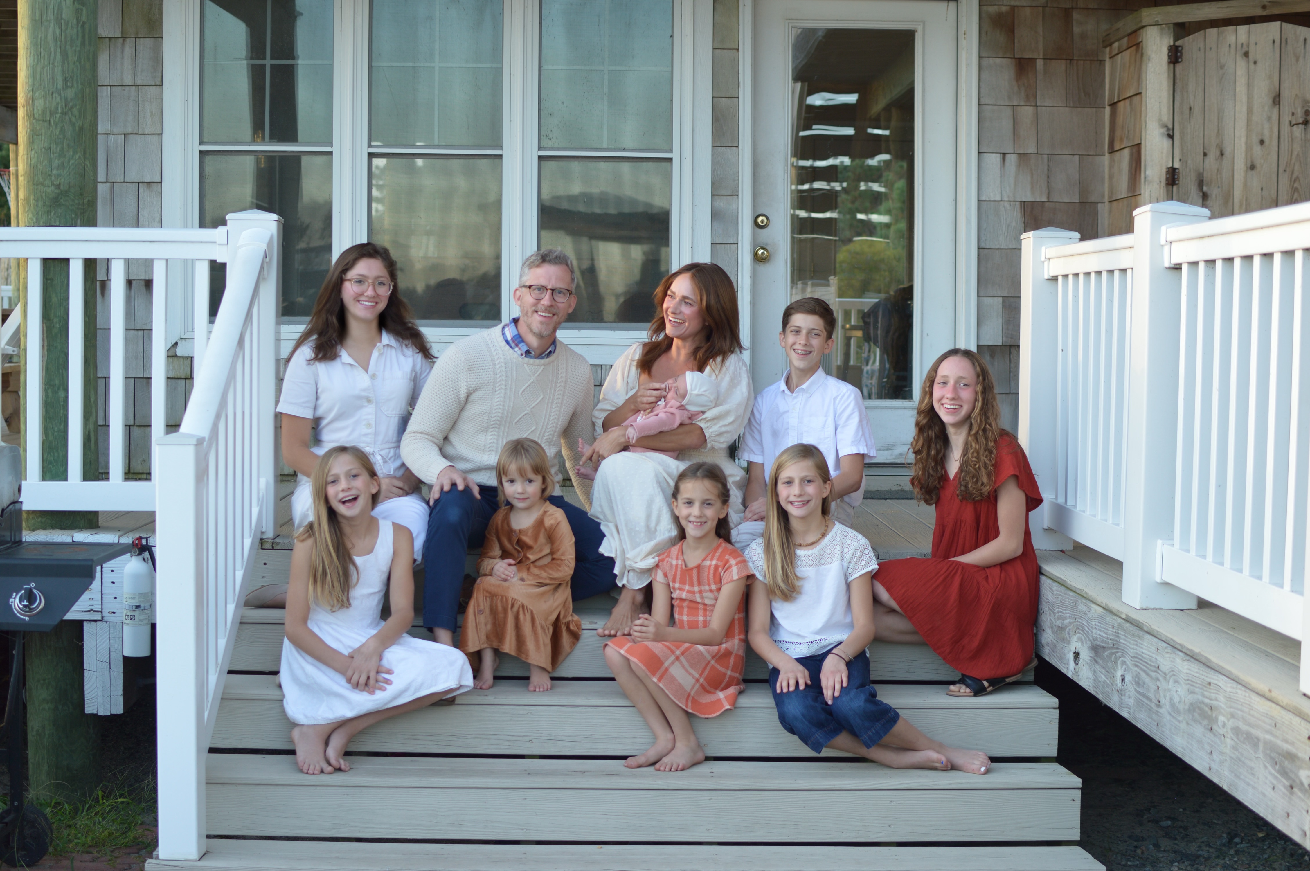 Mr. and Mrs. Collins with their 8 children.